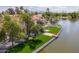 A waterfront home featuring a pristine yard with waterfront access that offers lakeside relaxation at 3520 N 110Th Ave, Avondale, AZ 85392