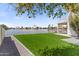 Backyard with lawn and waterfront access, offering a tranquil view at 3520 N 110Th Ave, Avondale, AZ 85392