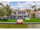 A waterfront home featuring a pristine backyard and outdoor dock offers lakeside tranquility at 3520 N 110Th Ave, Avondale, AZ 85392