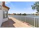 Balcony view showcasing an expansive lake view, blue skies and tropical landscape at 3520 N 110Th Ave, Avondale, AZ 85392