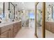 Elegant bathroom with marble accents, double vanity, and lake view at 3520 N 110Th Ave, Avondale, AZ 85392