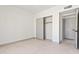 Well-lit bedroom with a spacious closet, providing ample storage and an access door to the rest of the home at 3520 N 110Th Ave, Avondale, AZ 85392
