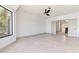 Bright bedroom with neutral tones, tiled floor, and ceiling fan at 3520 N 110Th Ave, Avondale, AZ 85392