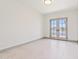 Bright bedroom with lake views visible through the french doors at 3520 N 110Th Ave, Avondale, AZ 85392
