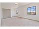 Spacious bedroom featuring neutral carpet, ample windows, and closet space for optimal storage at 3520 N 110Th Ave, Avondale, AZ 85392