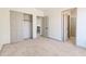 Bedroom with plush carpet, open door, and closet at 3520 N 110Th Ave, Avondale, AZ 85392