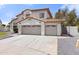 A two-story home with a driveway and attached three-car garage at 3520 N 110Th Ave, Avondale, AZ 85392