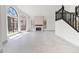 Bright foyer with staircase and a living room featuring a stone fireplace at 3520 N 110Th Ave, Avondale, AZ 85392