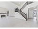 Bright foyer with staircase and a living room featuring a stone fireplace at 3520 N 110Th Ave, Avondale, AZ 85392