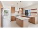 Modern kitchen with island, stainless appliances, pendant lighting and lake views at 3520 N 110Th Ave, Avondale, AZ 85392