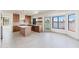 Bright kitchen features an island, stainless appliances, and views of the water at 3520 N 110Th Ave, Avondale, AZ 85392