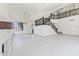 A spacious living room features vaulted ceilings and a staircase with dark wood railing at 3520 N 110Th Ave, Avondale, AZ 85392