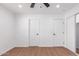 Bedroom featuring neutral paint, ceiling fan, and closets with wood look flooring at 3733 W Flynn Ln, Phoenix, AZ 85019