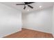 Bedroom featuring ceiling fan, neutral paint, with new wood-look flooring at 3733 W Flynn Ln, Phoenix, AZ 85019