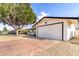 Attached two-car garage with a clean, white door and spacious driveway, perfect for extra parking at 3733 W Flynn Ln, Phoenix, AZ 85019