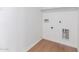 Laundry room area features wood floors, white walls, and washer and dryer hookups at 3733 W Flynn Ln, Phoenix, AZ 85019