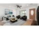 Staged living room featuring a comfortable sofa, armchairs, and stylish decor at 3733 W Flynn Ln, Phoenix, AZ 85019