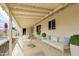 Covered patio with an outdoor seating area, a view of the pool, and potted plants at 3733 W Flynn Ln, Phoenix, AZ 85019