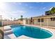 Sparkling swimming pool surrounded by a white fence, perfect for hot summer days at 3733 W Flynn Ln, Phoenix, AZ 85019