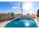 Inviting backyard pool boasts clear water, tile accents, and sun-drenched surroundings at 3733 W Flynn Ln, Phoenix, AZ 85019
