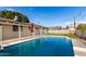 Backyard swimming pool with lounge umbrella features a classic design and refreshing appeal at 3733 W Flynn Ln, Phoenix, AZ 85019