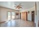 Bright room with balcony access and a decorative ceiling fan at 38065 N Cave Creek Rd # 9, Cave Creek, AZ 85331