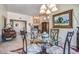 Elegant dining area adjacent to the living room with a modern chandelier and southwestern-inspired decor at 38065 N Cave Creek Rd # 9, Cave Creek, AZ 85331