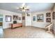 Large office space with tile flooring, ample lighting, art, and a ceiling fan at 38065 N Cave Creek Rd # 9, Cave Creek, AZ 85331