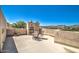 Expansive patio with a built-in fireplace, seating area, and scenic views at 38065 N Cave Creek Rd # 9, Cave Creek, AZ 85331