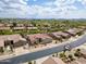 Expansive aerial view of desert homes with tile roofs and desert landscaping in a desirable neighborhood at 4607 E Sierra Sunset Trl, Cave Creek, AZ 85331
