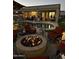 Inviting backyard featuring a fire pit, pool, outdoor kitchen, and a covered patio ideal for entertaining at 4607 E Sierra Sunset Trl, Cave Creek, AZ 85331
