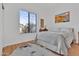 Bright bedroom features a light gray color palette, a beautiful view and wood flooring at 4607 E Sierra Sunset Trl, Cave Creek, AZ 85331