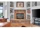 Detailed shot of living room fireplace with custom stonework and custom shelving and lighting at 4607 E Sierra Sunset Trl, Cave Creek, AZ 85331