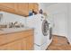 Laundry room with washer and dryer, wood cabinets, sink and tile flooring at 4607 E Sierra Sunset Trl, Cave Creek, AZ 85331