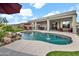 Resort-style pool with rock waterfall, seating and manicured landscaping at 4607 E Sierra Sunset Trl, Cave Creek, AZ 85331
