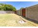 Fenced backyard with lush foliage and a grassy area, creating a private outdoor retreat at 4713 E Cambridge Ave, Phoenix, AZ 85008