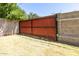 Fenced backyard with privacy fence and mature foliage at 4713 E Cambridge Ave, Phoenix, AZ 85008