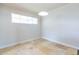 Light-filled bedroom with tile floors, white walls, and a window with blinds at 4713 E Cambridge Ave, Phoenix, AZ 85008