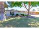 Charming home with well-manicured front yard, mature trees, and tasteful landscaping at 4713 E Cambridge Ave, Phoenix, AZ 85008