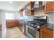 Modern kitchen with stainless steel appliances, sleek cabinetry, and granite countertops at 4713 E Cambridge Ave, Phoenix, AZ 85008
