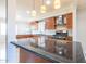 Updated kitchen featuring wood cabinets, granite countertops, and stainless steel appliances at 4713 E Cambridge Ave, Phoenix, AZ 85008