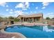 Refreshing private pool with a rock waterfall feature and a spacious patio for relaxing and entertaining outdoors at 5005 E Baker Dr, Cave Creek, AZ 85331