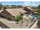 Landscaped backyard with a covered patio, desert plants and a refreshing swimming pool at 5005 E Baker Dr, Cave Creek, AZ 85331