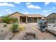 Backyard patio with an outdoor grill, fire pit, desert landscaping, and backyard toys at 5005 E Baker Dr, Cave Creek, AZ 85331