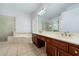 Elegant bathroom featuring dual sinks, soaking tub, and a glass-enclosed shower at 5005 E Baker Dr, Cave Creek, AZ 85331