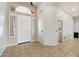 Inviting entryway with tiled floor and ample natural light streaming through shuttered windows at 5005 E Baker Dr, Cave Creek, AZ 85331