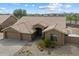 Charming single-story home featuring a well-manicured front yard with mature desert landscaping and a spacious driveway at 5005 E Baker Dr, Cave Creek, AZ 85331