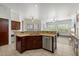 Open-concept kitchen featuring granite counters, stainless appliances, and tile flooring at 5005 E Baker Dr, Cave Creek, AZ 85331