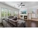 Bright living room features a cozy fireplace, built-in bookshelves, large windows and plank flooring at 5005 E Baker Dr, Cave Creek, AZ 85331