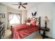 Bedroom with ceiling fan, view, and a picture of a dog on the wall at 5350 E Deer Valley Dr # 4239, Phoenix, AZ 85054